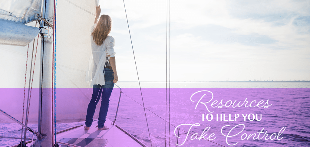 Resources to Help You Take Control: a woman stands at the bow of a sailboat looking out to sea